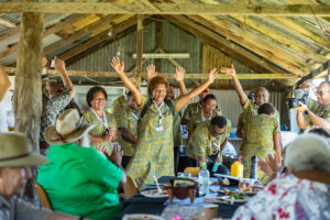 Fijian delegates in traditional dress perform a dance for Nywaigi Traditional Owners